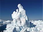 Iceberg ocean landscape. Strange white shapes rising from the sea.