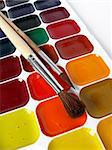 watercolor paints set with brushes