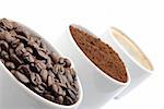 cups with coffe beans, blend and espresso. closeup