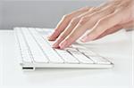 woman hands typing keyboard on desktop