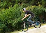 young biker riding a bmx bicycle