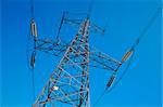 Electric power pole against blue sky