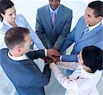 High angle of multi-ethnic business team with hands together