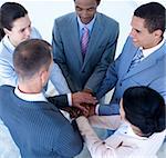 High angle of international business team with hands together