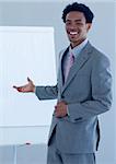 Afro-American businessman giving a presentation on the whiteboard