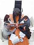 High angle of business team with hands together in a meeting