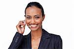 Portrait of a smiling Indian businesswoman talking on a headset