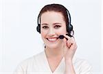 Attractive businesswoman with a headset on smiling at the camera