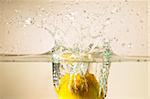 Fresh lemon dropped into water