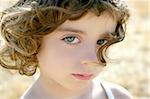Beautiful little girl portrait outdoor looking to camera