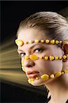 pretty young blond woman with a yellow stones necklace around her face