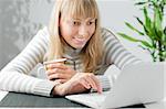 young beautiful girl with notebook and cup of drink