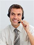 Portrait of an attractive young businessman working in a call center