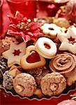 Detail of delicious Christmas cookies with candles in red tone