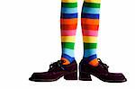 Wacky clown feet with crazy striped socks and oversized purple suede shoes!  Isolated.