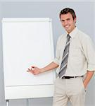 Smiling businessman giving a presentation in the office