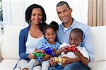 Happy young Afro-American family at home