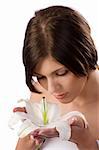 close up portrait of a beauty young girl smelling a big white lily from her hands