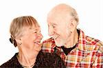 Smiling senior couple on white background
