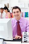 Portrait of a confident businessman working at his computer in the office