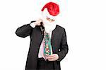 Businessman in suit with santa hat on head try on necktie. Isolated over white background
