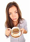 Tired woman with empty and bored eyes looking at the camera having spilled a little coffee. Beautiful mixed race asian / caucasian model isolated on white background.