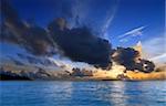 Beautiful colorful sunset over the ocean in the Maldives seen from the beach - HDR