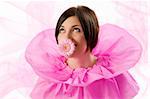 funny shot of a young nice girl looking up with pink collar paper keeping a flower in her mouth