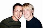 Two handsome men posing for portrait on white background