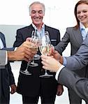 Business team celebrating a success with Champagne