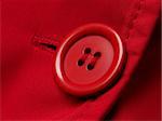 red button with shallow DOF red clothes background