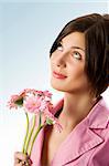 nice shot of a cute young woman with pink jacket and pink flowers