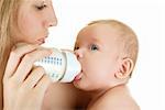 Mother give drink her baby boy by feeding bottle