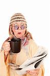 Crazy new age woman in a yellow robe with coffee cup and newspaper