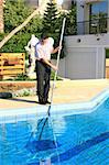 Swimming pool cleaner at  work.