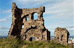 The medieval ruins of St. Anthony's chapel in Holyrood Park overlooking the city of Edinburgh.