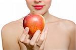 young blonde woman offering red apple, shallow DOF, Focus on the apple