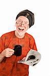 Funny senior guru with newspaper and coffee