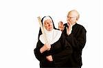 Funny priest admonishes angry nun with ruler as weapon