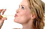 Beautiful blond woman drinking a glass of white wine