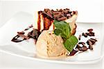 cheesecake  with ice cream, chocolate shavings and mint