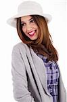 Young model with spring clothing and white hat on a white isolated background