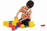 Smart boy playing with blocks on white isoalted background