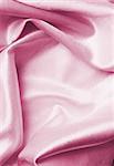 Pastel pink silk fabric folded, good for background.