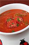 Delicious homemade tomato soup with onion and parsley