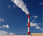 Steam from a pipe against the dark blue sky