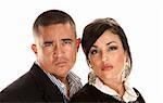 Skeptical or angry Hispanic couple on white background