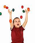 Little ecstatic boy with falling easter eggs - isolated