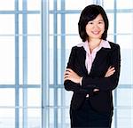 Asian business women standing in office.