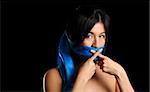 Girl gagged with blue scarf crosses her fingers